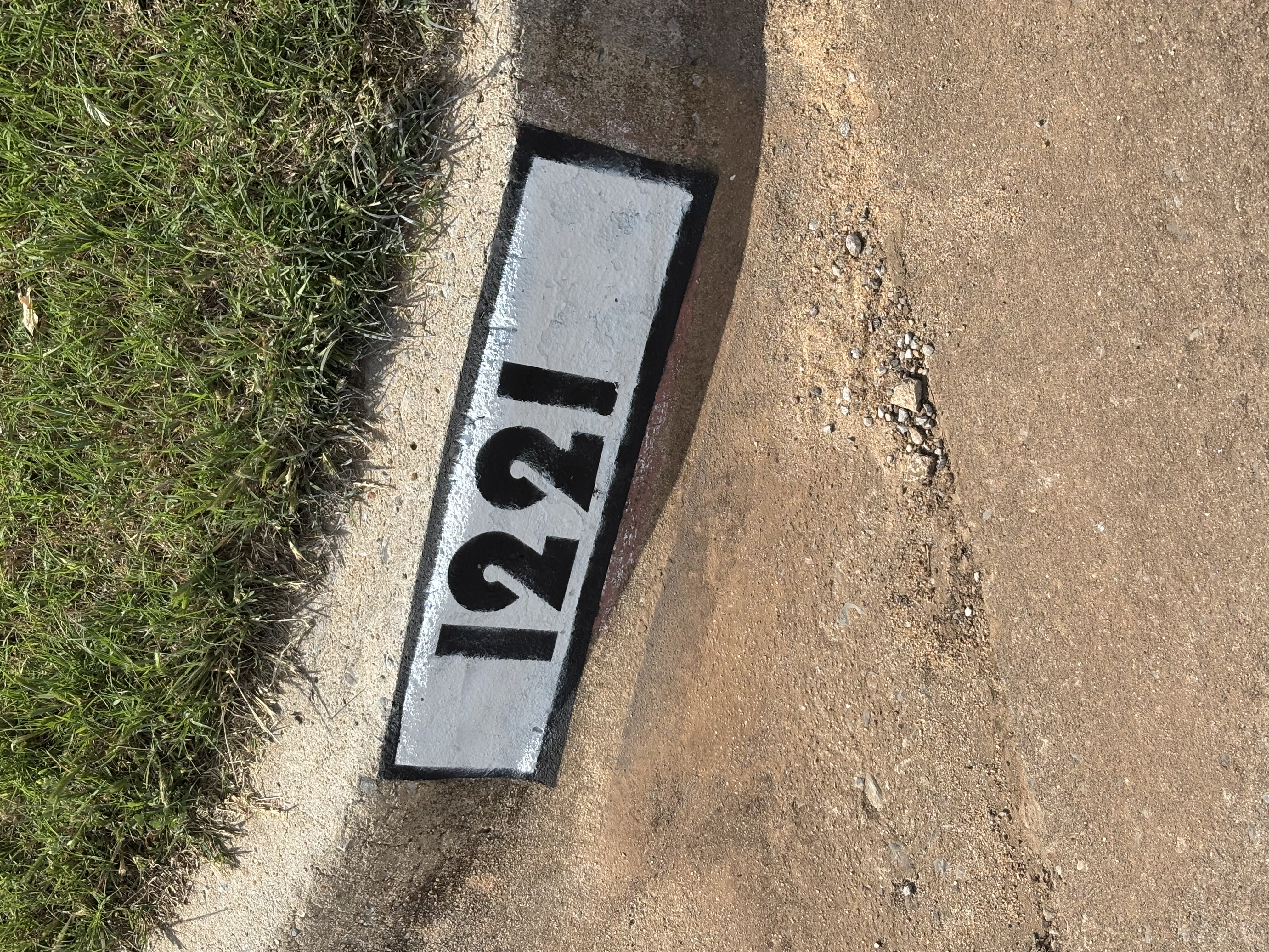 Fresh painted curb number 1221