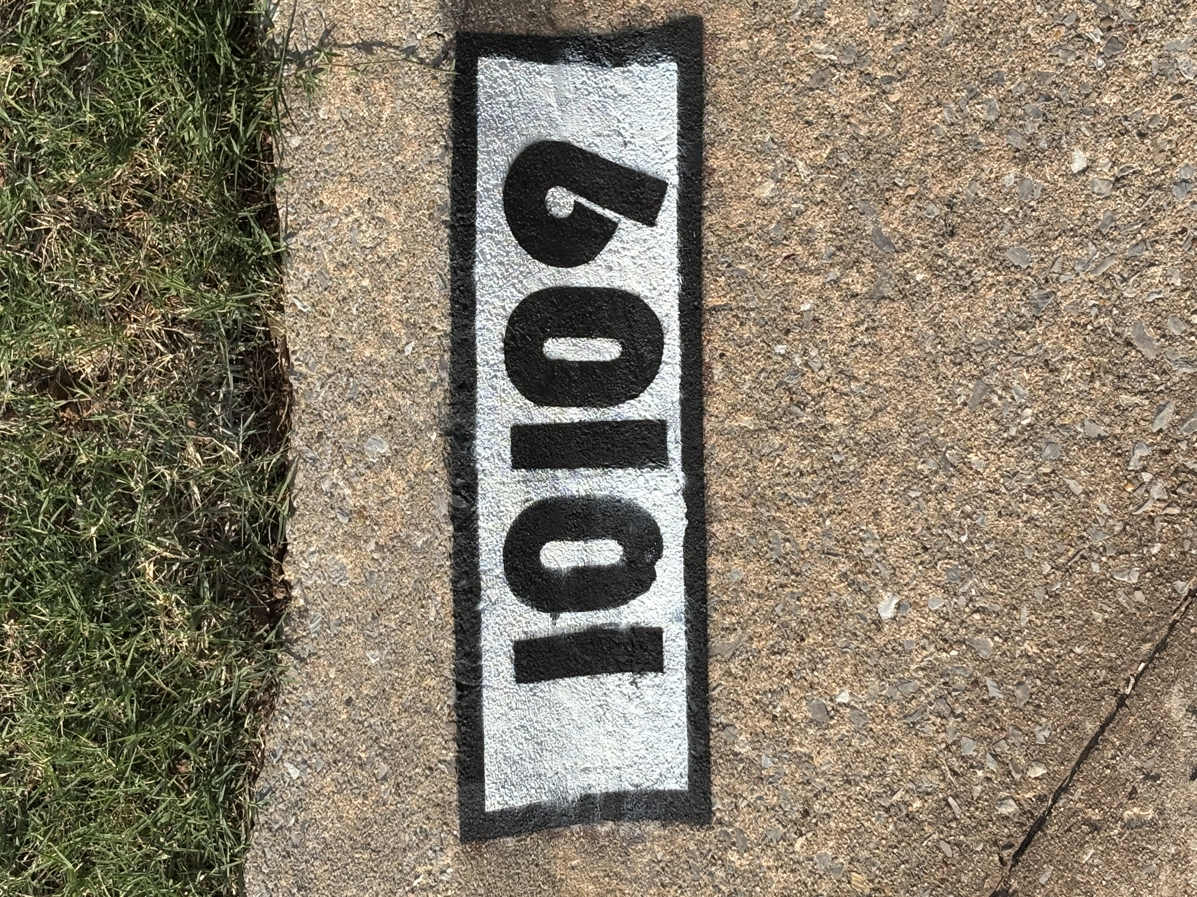 Fresh painted curb number 60109